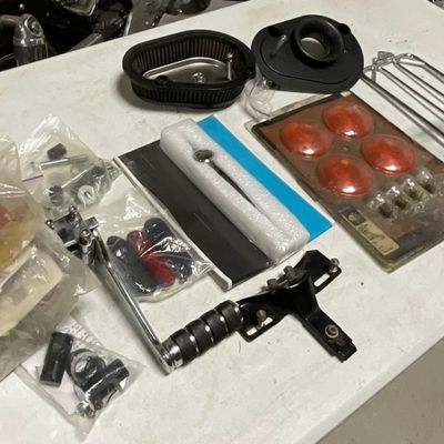 An Assortment of Harley-Davidson and Aftermarket Motorcycle Parts and Accessories