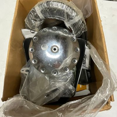 An Assortment of Harley-Davidson Motorcycle Parts and Accessories Including Air Cleaner Cover and Ignition Sensor Plate