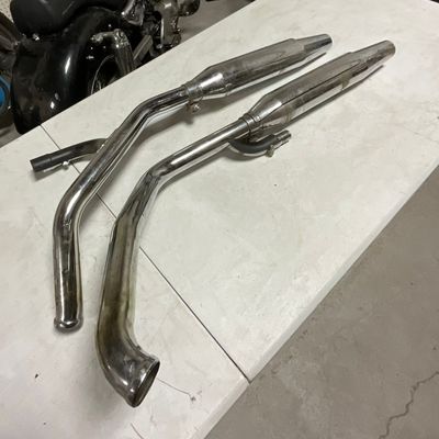 A Pair of Harley-Davidson OEM Chrome Exhaust Head Pipes and Mufflers Part Number 55344-99