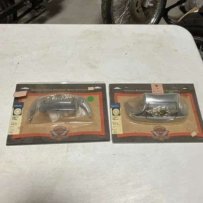 ** A Pair of Harley-Davidson Motor Company Chrome Fender Tips

**Detailed Description:** This lot contains a matching set of chrome...