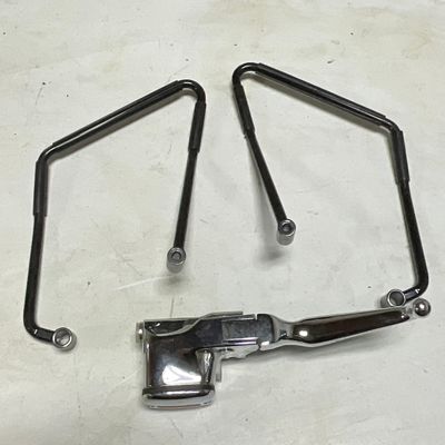 Three Motorcycle Components Including Front Brake Master Cylinder and Saddlebag Support Brackets
