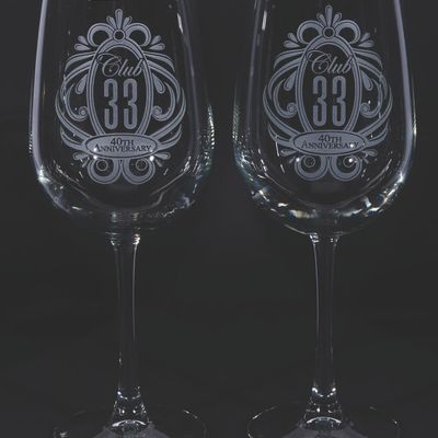 A Pair of Club 33 40th Anniversary Wine Glasses.