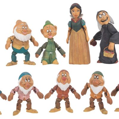 A Set of "Snow White and the Seven Dwarfs" Wooden Dolls.