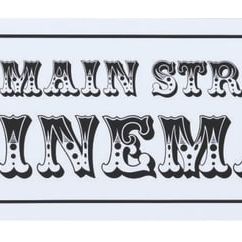 A Main Street Cinema Horse-Drawn Street Car Sign.