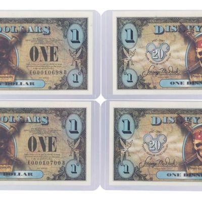 The 2007 Disney Dollars 20th Anniversary Black Pearl Series $1 Bills.