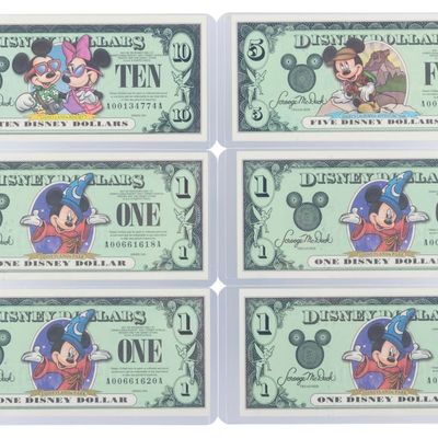 The Disneyland 2001 AA Series $1, $5, and $10 Bills.