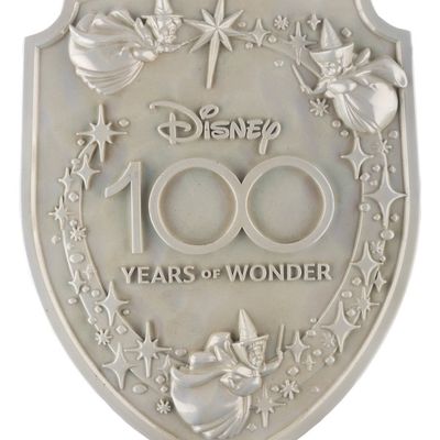 A Disneyland "Disney 100 Years of Wonder" Lamppost Shield.