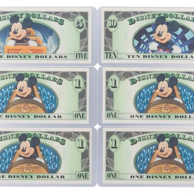 The 2014 Disney Dollars Mountains of Disney Series $1, $5, and $10 Bills.