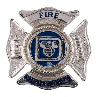 A Disney Fire Prevention Hat Badge.