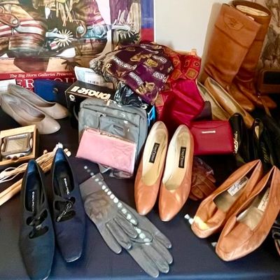 Assortment of vintage women's accessories, including leather pumps, flats, boots, gloves, and a boxed silver-plated flatware set.
