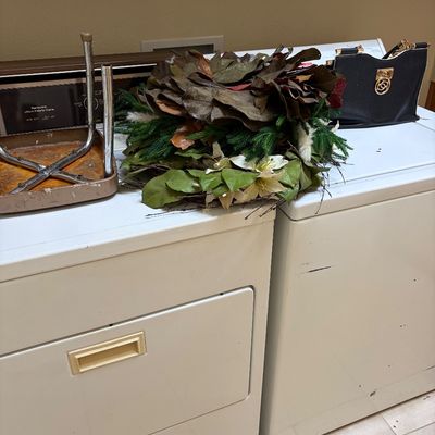 Sale Photo Thumbnail #28: Kenmore Ultra Fabric Care washer and dryer set, shown with a decorative autumn wreath and a black handbag resting on top.