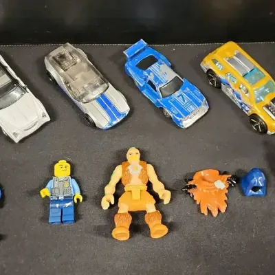 Bottom Toy Chest - Imaginext Pterodactyl & Caveman Figure, Lego Police Officer, 6 Diecast Cars