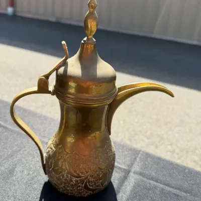 Antique traditional Middle Eastern brass coffee pot, known as a dallah