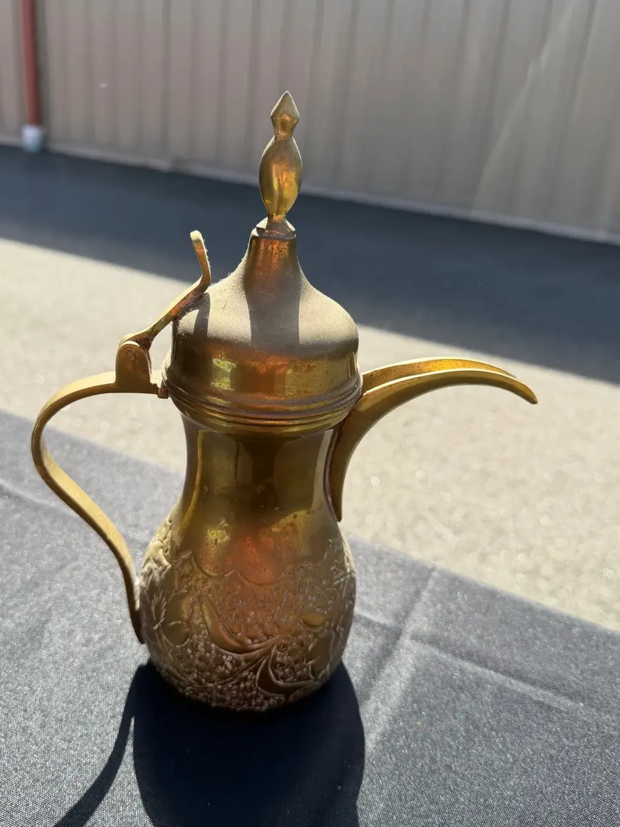Antique traditional Middle Eastern brass coffee pot, known as a dallah
