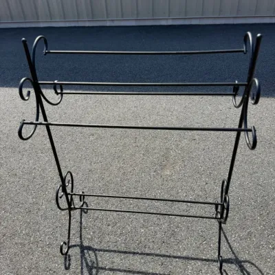 Freestanding black metal quilt rack