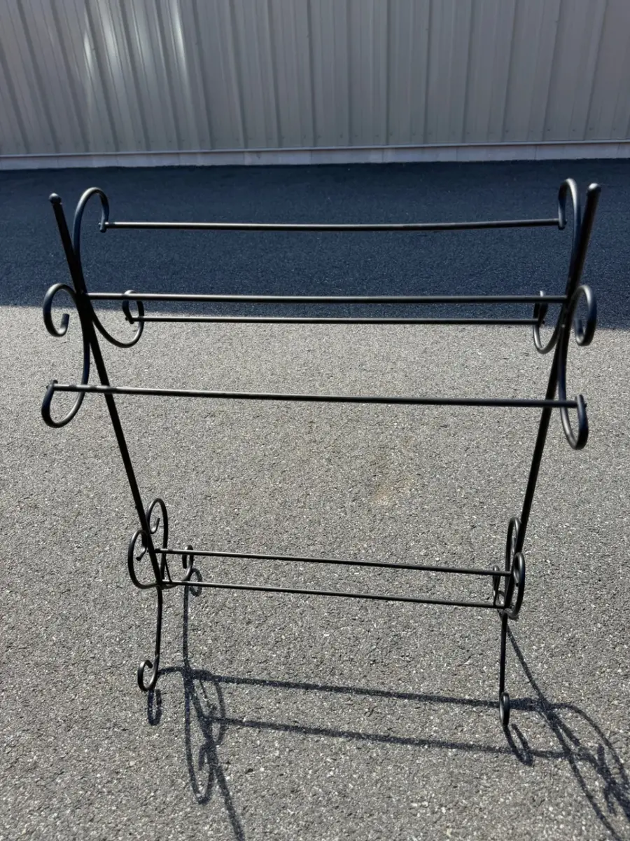 Freestanding black metal quilt rack
