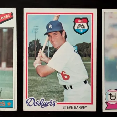 Three vintage Topps baseball cards featuring Los Angeles Dodgers first baseman Steve Garvey, including his 1975, 1978, and 1981 N.L....