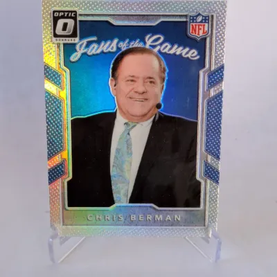 Donruss Optic "Fans of the Game" Chris Berman trading card, displayed on a clear plastic stand.
