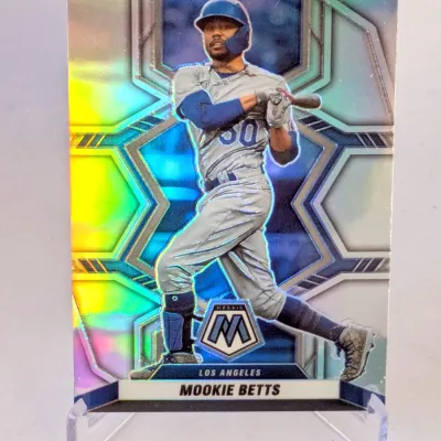 Panini Mosaic Mookie Betts Los Angeles baseball card, featuring a vibrant holographic background and displayed on a clear acrylic stand.