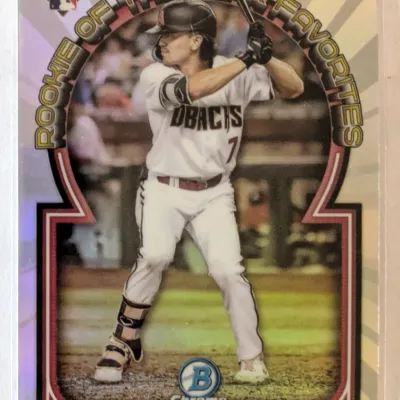 Bowman Chrome Corbin Carroll Rookie of the Year Favorites baseball card, featuring a refractor finish and housed in a protective sleeve.