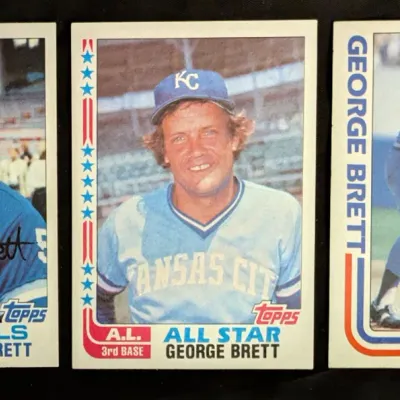 Three vintage 1982 Topps George Brett baseball cards, including his base card, American League All-Star card, and "In Action"...