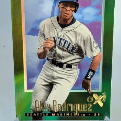 2000 E-X Alex Rodriguez Seattle Mariners baseball card, featuring a green foil border and displayed on a clear plastic stand.