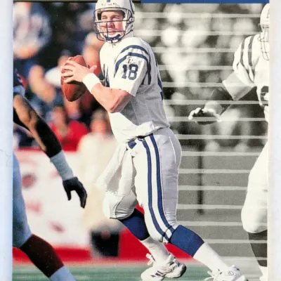 1999 Donruss Peyton Manning Indianapolis Colts football card, showing the quarterback in his white away uniform.