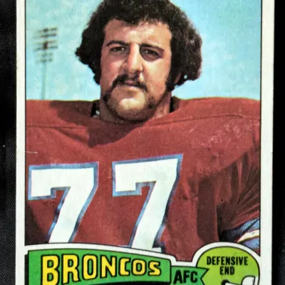 Vintage 1974 Topps Lyle Alzado football card, number 383, featuring the Denver Broncos defensive end in moderate condition with slight...