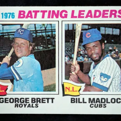 1977 Topps baseball card #1, featuring 1976 Batting Leaders George Brett of the Kansas City Royals and Bill Madlock of the Chicago Cubs.