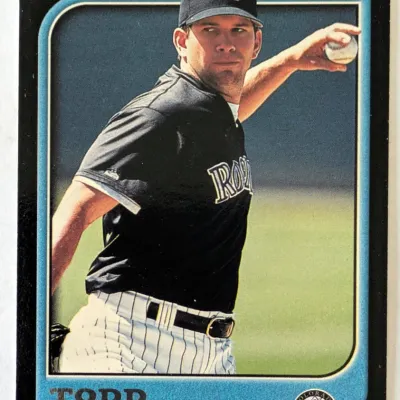 1998 Bowman Todd Helton baseball card, featuring the Colorado Rockies first baseman in a throwing pose.