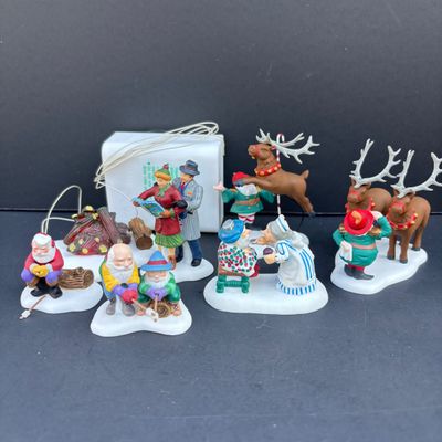 LOT 142: Village Accessories by Dept 56: Planning a Winter Vacation, Marshmallows Around the Campfire, Open Wide, Twinkling Lit Shrubs...