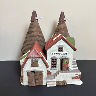 LOT 83: Dept 56 Heritage Village Collection Dickens Village Series: Village Church & Bishop Oast House & Village Porcelain Pine Tree