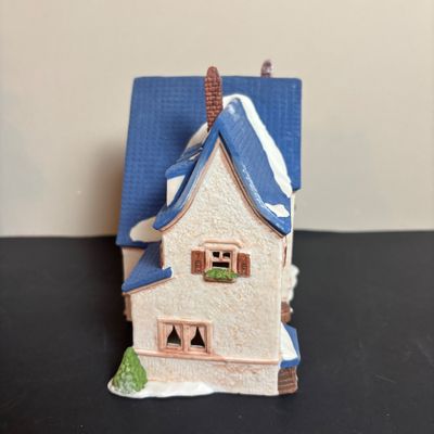 LOT 97: Dept 56 Alpine Village Series: Stoder Grist Mill, Apotek & Tabak along with a Village Porcelain Pine Tree