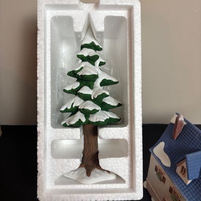 LOT 97: Dept 56 Alpine Village Series: Stoder Grist Mill, Apotek & Tabak along with a Village Porcelain Pine Tree