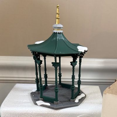 LOT 39: Dept 56 Holiday Accessories - Town Square Gazebo, Village Porcelain Pine Small and Large, Postern and Decorated Sisal Christmas...
