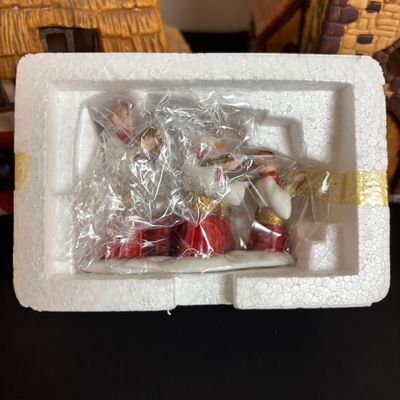 LOT 86: Dept 56 Heritage Village Collection: Choirboys All in a Row, Carolers on the Doorstep & Dickens Series Village Church &...