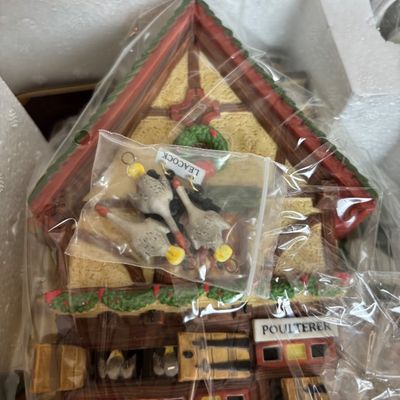 LOT 87: Dept 56 Dickens Village Houses w/Original Boxes: Leacock Poultry, Peggotty's Seaside Cottage, Betsy Trotwood's Cottage