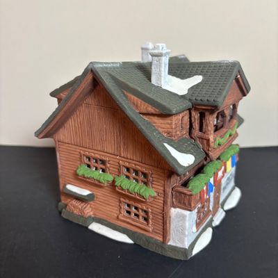 LOT 96: Dept 56 Alpine Village Series E. Staubr & Besson Bierkeller along with Porcelain Pine Tree