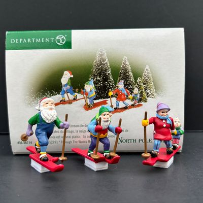 LOT 143: Village Accessories by Dept 56: Delivering Real Plastic Snow, Santa in the City, Elves on Track, Photo w/Santa, Tangles in...
