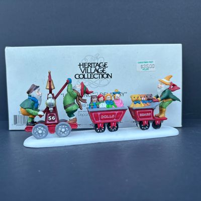 LOT 79: Dept 56 Accessories w/Original Boxes: Popcorn Vendor, Dickens' Carolers, Last Minute Delivery, All Around the Town,...