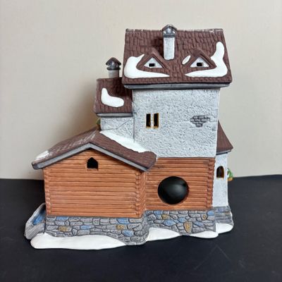 LOT 97: Dept 56 Alpine Village Series: Stoder Grist Mill, Apotek & Tabak along with a Village Porcelain Pine Tree