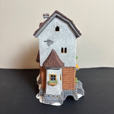LOT 97: Dept 56 Alpine Village Series: Stoder Grist Mill, Apotek & Tabak along with a Village Porcelain Pine Tree