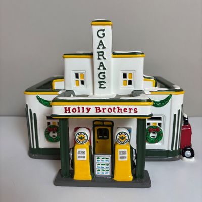 LOT 82: Dept 56 Snow Village Collection: Holly Brothers Garage, Pisa Pizza & Village Used Car Lot