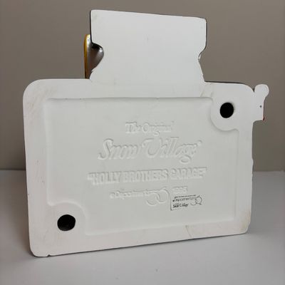 LOT 82: Dept 56 Snow Village Collection: Holly Brothers Garage, Pisa Pizza & Village Used Car Lot