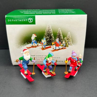LOT 143: Village Accessories by Dept 56: Delivering Real Plastic Snow, Santa in the City, Elves on Track, Photo w/Santa, Tangles in...