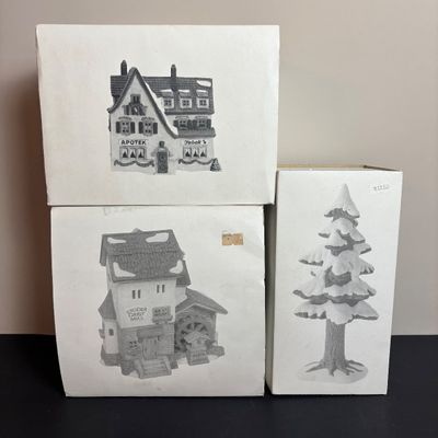 LOT 97: Dept 56 Alpine Village Series: Stoder Grist Mill, Apotek & Tabak along with a Village Porcelain Pine Tree