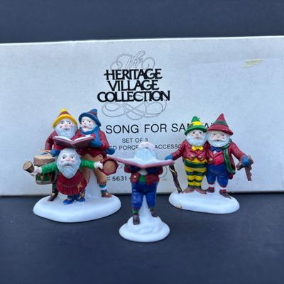 LOT 76: Dept 56 Accessories w/Original Boxes: Sing a Song for Santa, Carolers on the Doorstep, Violet Vendor- Chestnut Vendor-Carolers,...