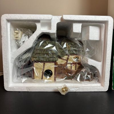 LOT 92: Dept 56 Dickens Village w/Original Boxes: Crooked Fence Cottage, Scrooge & Marley Counting House, Postern & Porcelain Tree
