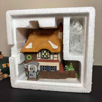 LOT 87: Dept 56 Dickens Village Houses w/Original Boxes: Leacock Poultry, Peggotty's Seaside Cottage, Betsy Trotwood's Cottage