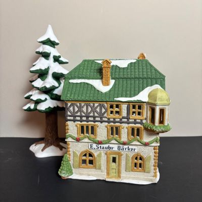LOT 96: Dept 56 Alpine Village Series E. Staubr & Besson Bierkeller along with Porcelain Pine Tree